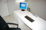 A vertical office table made from white fiberglass